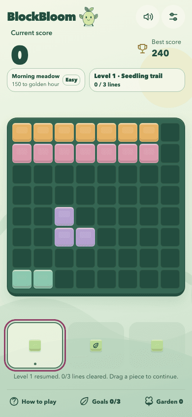 BlockBloom development build showing colorful blocks, the level goal, score and three pieces ready to place